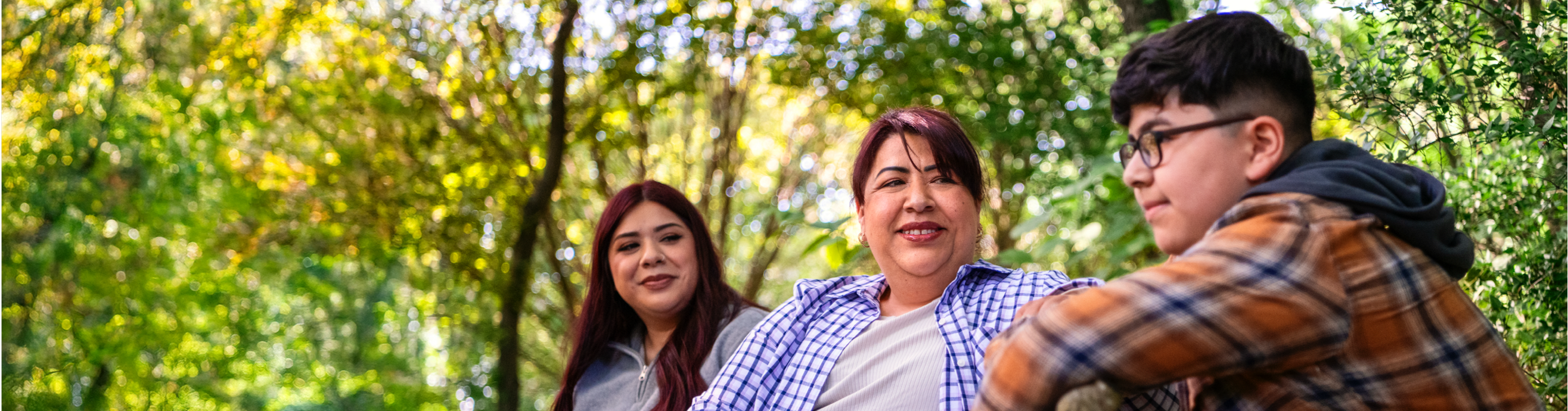 Maricela is with children and smiling.
