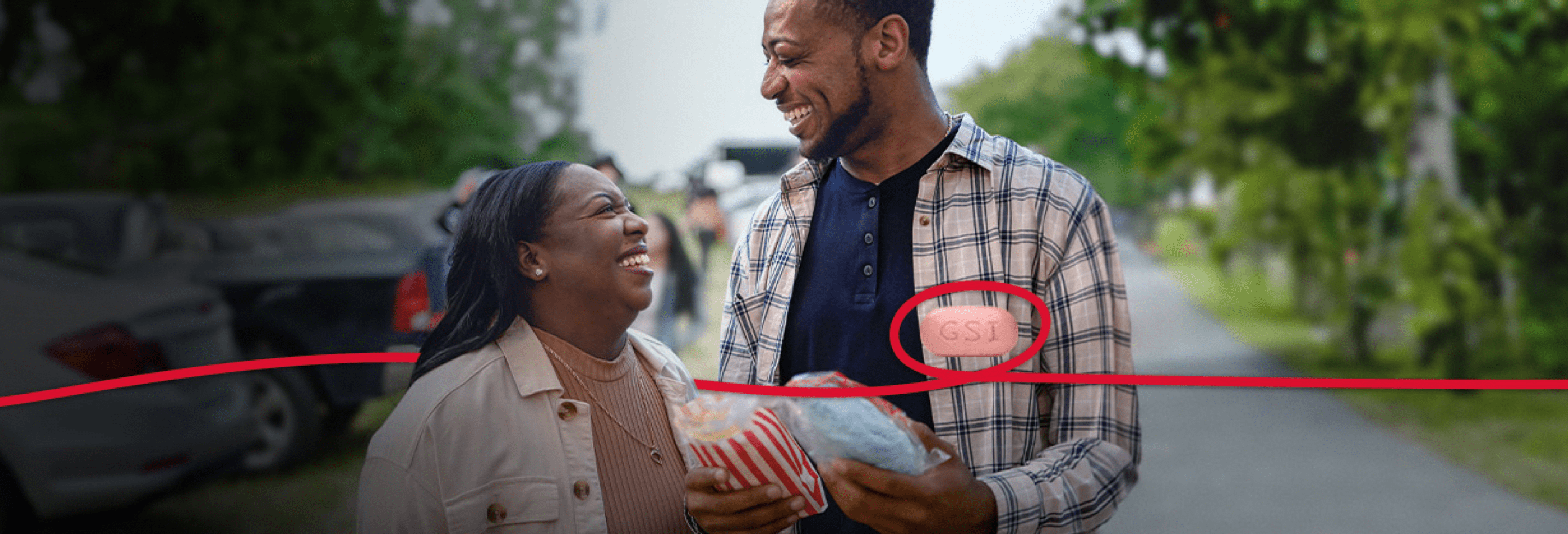 Tamera and a man are smiling at one  another. 