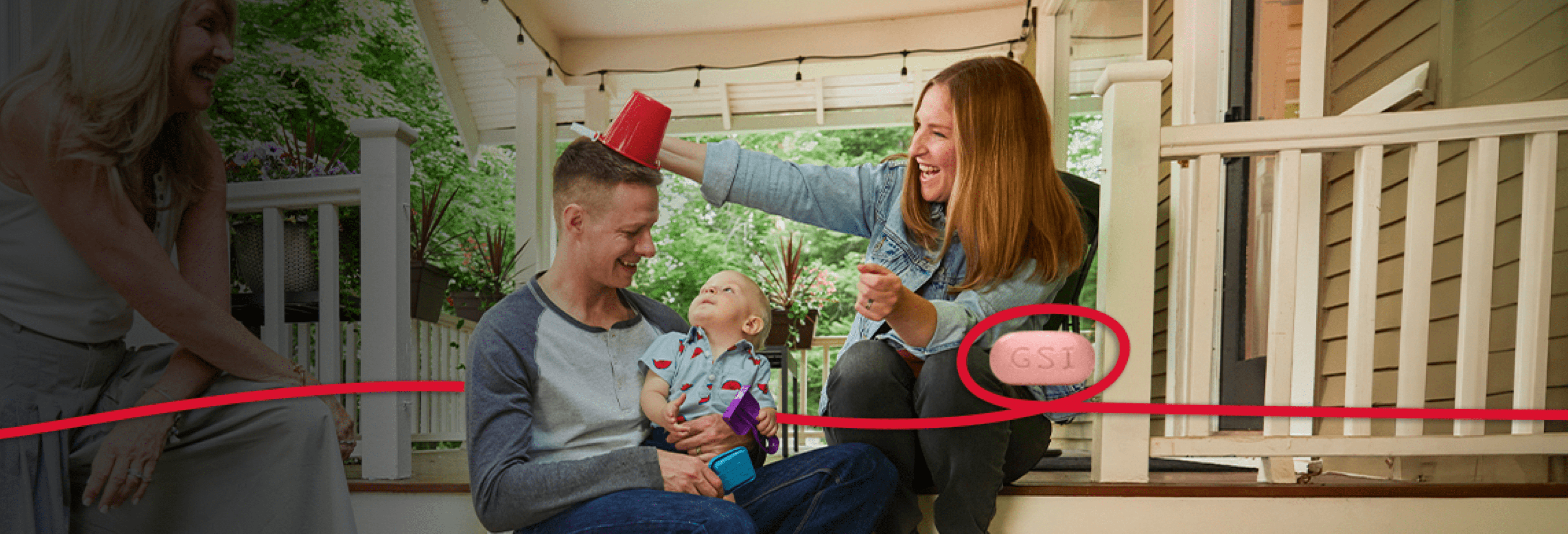 Zach is holding a baby. 